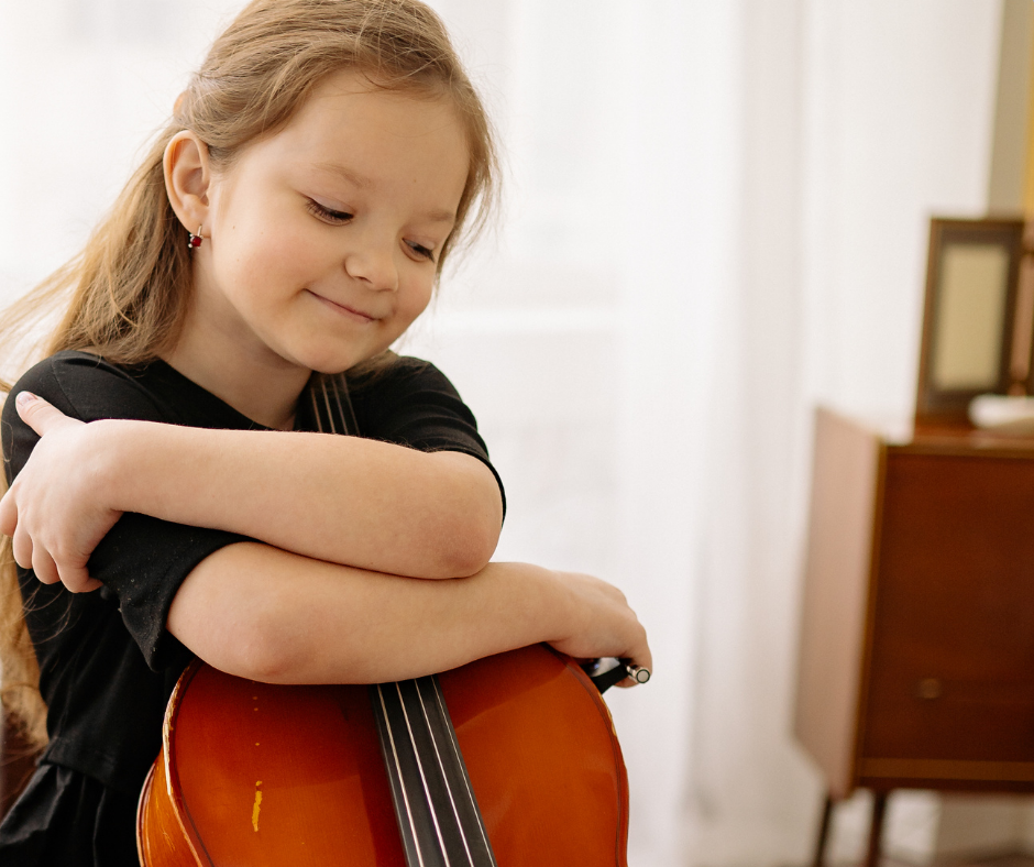 Girl hugging cello